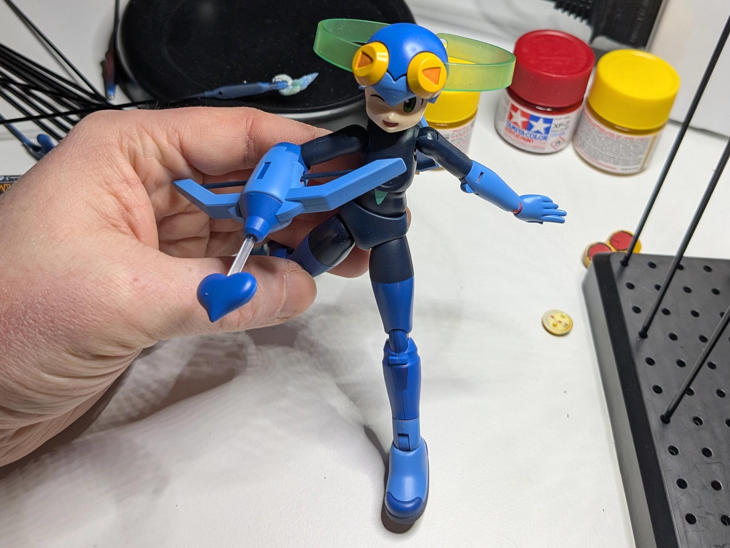 Model kit of Roll.exe painted MegaMan.exe colors, with a few pieces missing