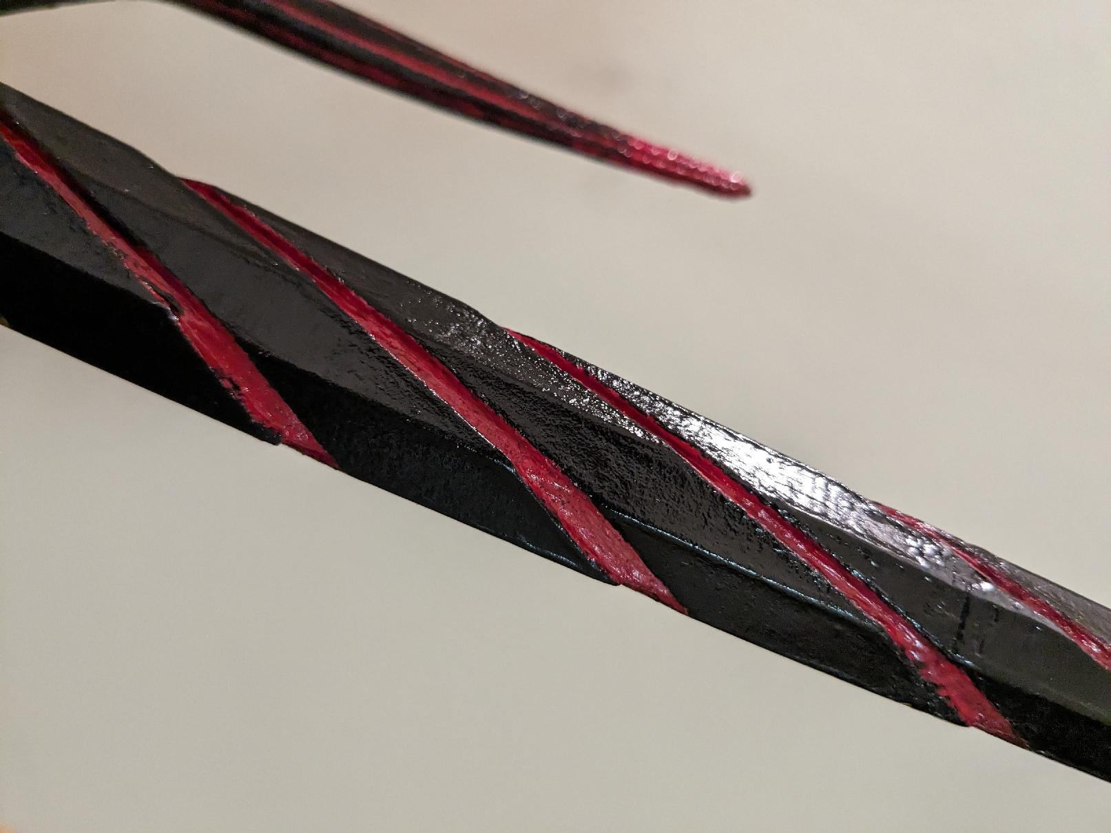 Zoomed in picture of the red lines on Milady's sai